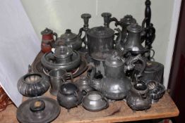 Collection of pewter including teapots, lidded jug, candlesticks, biscuit jar, etc.