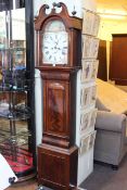 Antique mahogany eight day longcase clock having painted arched dial.