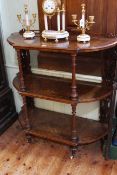 Victorian burr walnut and satinwood inlaid three tier etagé having bow ends and turned columns, 102.