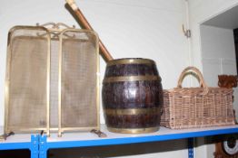 Brass collared oak barrel, wicker basket, walking cane and a brass fire guard.