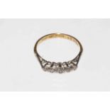 18 carat gold five stone diamond ring, size M.