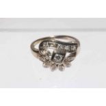 Thirteen stone diamond fancy setting ring, unmarked white metal but probably gold, size L.
