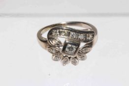 Thirteen stone diamond fancy setting ring, unmarked white metal but probably gold, size L.