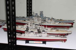 Five models of Naval war ships.