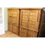 Pair Mexican pine four door cabinets fitted with shelves, 188cm by 125cm.