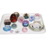 Caithness, Mdina and other glass paperweights.