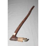 Soloman Islands adze bearing F.S. Clark collection label to stone and handle, length 59cm.