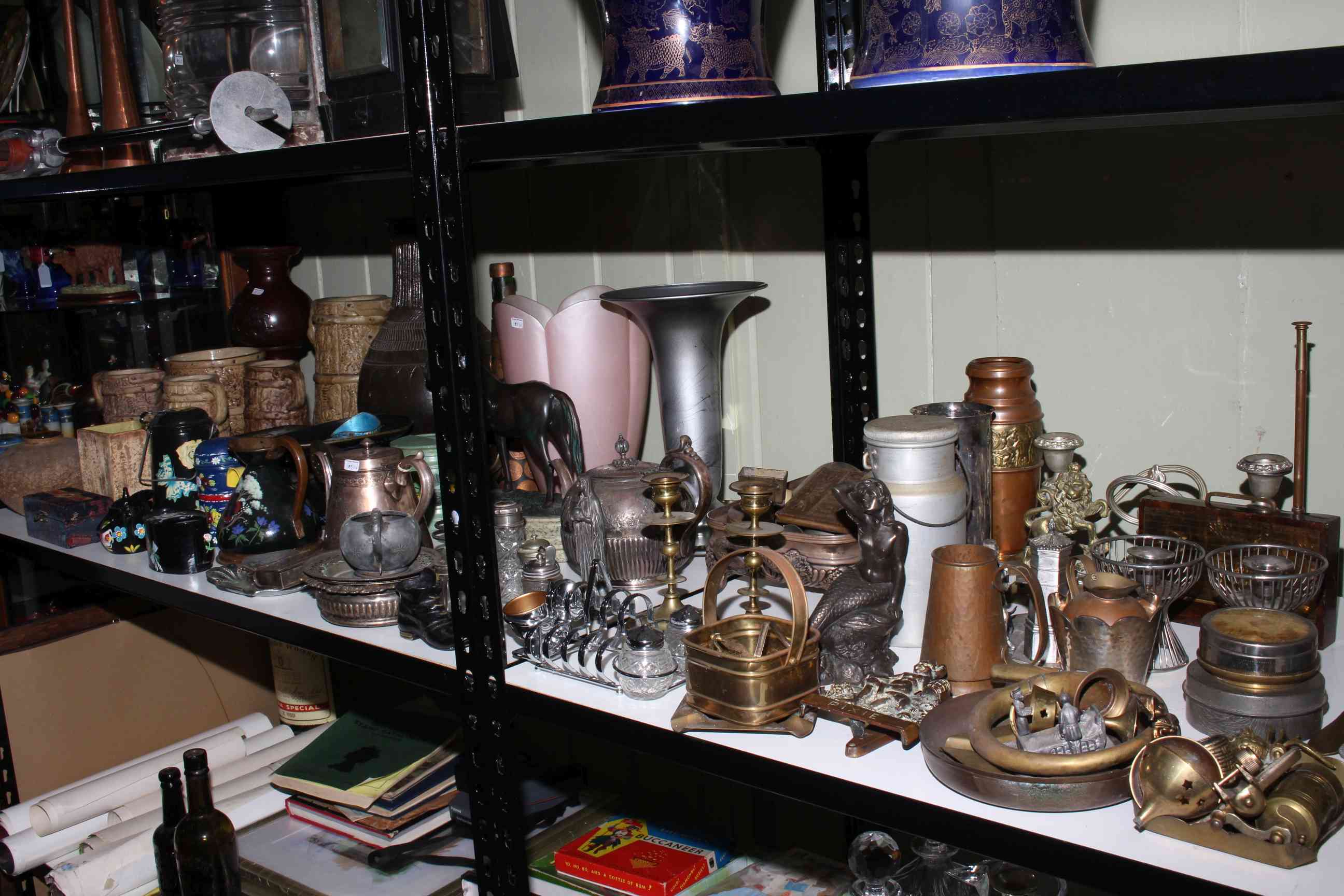 Shelf collection of stoneware, metalwares including teapot, milk churn, door stopper,