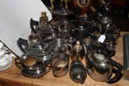 Plated tea sets, tankards, brass candlesticks, etc.