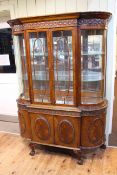 Edwardian mahogany cabinet having two glazed doors above two cupboard doors with bowed sides and on