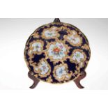 Continental (Meissen) porcelain dish with gilt bordered flower pointed panels, 28.5cm diameter.