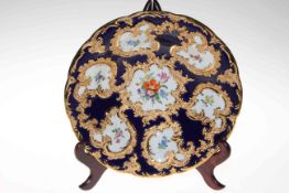 Continental (Meissen) porcelain dish with gilt bordered flower pointed panels, 28.5cm diameter.