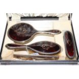 Boxed silver and tortoiseshell brush, mirror and comb set.