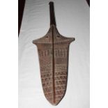 Fijian Kinikini paddle club with carved decoration, length 111cm.