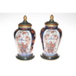 Pair of Imari vases with lids on stands, 35cm.