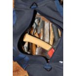 Bag of tools including axes, drill bits, trowel, etc.