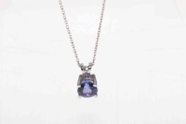 18 carat white gold fine loop chain with tanzanite claw set pendant,