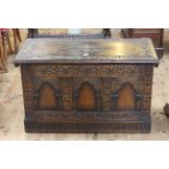 Carved oak triple arched panel front coffer, 55cm by 92cm.