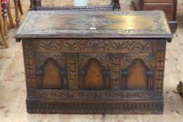 Carved oak triple arched panel front coffer, 55cm by 92cm.