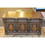 Carved oak triple arched panel front coffer, 63cm by 117cm.