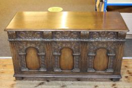 Carved oak triple arched panel front coffer, 63cm by 117cm.