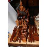 Collection of carved wood animals, tribal spoons and forks, statues, etc.