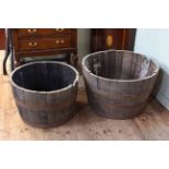 Two 1/2 barrel garden planters, 48cm by 76cm and 43cm by 65cm.