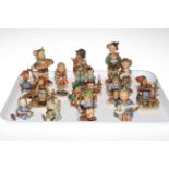 Fifteen Hummel figures.