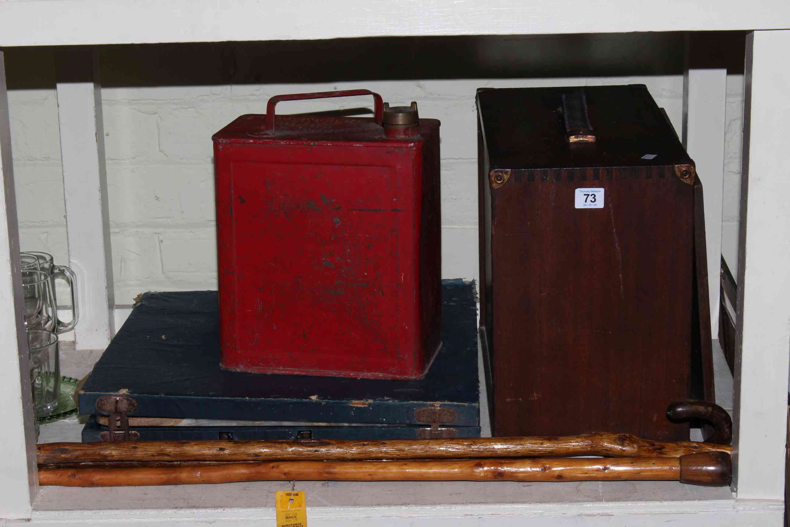 Emir tool cabinet, petrol can, onyx chess set and three walking sticks.