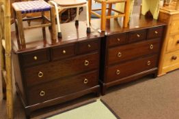 Pair Stag Minstrel five drawer chests.