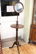 Mahogany tripod vanity stand with adjustable mirror.