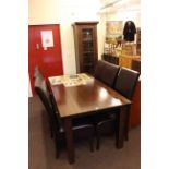 Contemporary hardwood eight piece dining suite comprising slim glazed door cabinet,