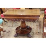 Victorian mahogany fold top tea table on octagonal form to four paw feet, 73cm by 96cm (closed).