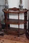 Victorian burr walnut and satinwood inlaid three tier etage having bowed sides and turned columns,