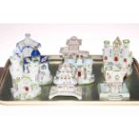 Collection of eight Coalport cottages.