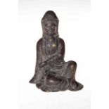 Chinese cast bronze seated female figure, 22cm.