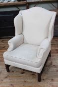 Georgian style wing armchair in light fabric.