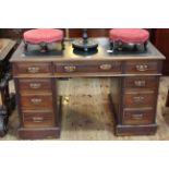 Edwardian mahogany nine drawer pedestal desk, 75cm by 122cm.