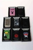 Eight boxed Zippo lighters.