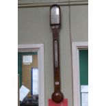 L. Casella, London antique walnut stick barometer.