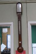 L. Casella, London antique walnut stick barometer.