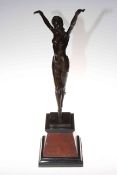 Art Deco bronze lady in a dancing pose, on marble plinth, 54cm high.