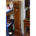 Art Deco walnut grandmother clock with striking movement.