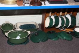 Ten piece pan set, marked Chasseur Invicta in La Creuset style and a wooden pan stand.