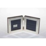 Silver hinged double photograph frame.