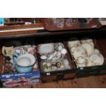 Three boxes of tea and dinner wares including Meakin 'Sunburst', Royal Crown Derby cups and saucers,