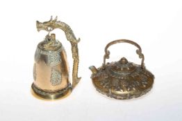 Oriental brass teapot and bell.