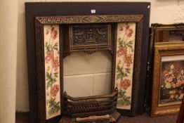 Cast metal and tiled fireplace.