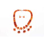 Late Victorian faceted amber colour bead necklace with gilt drops,