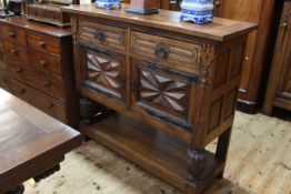 Oak side cabinet with drawers above cupboards, 1.25m wide, 1.11m high and 0.45m deep.